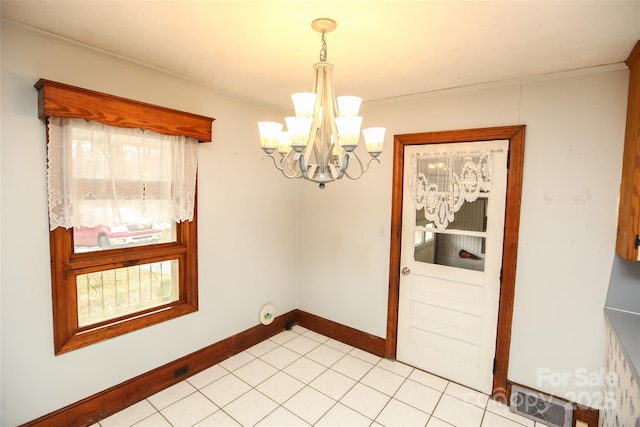 unfurnished dining area featuring baseboards, visible vents, light tile patterned flooring, crown molding, and a notable chandelier