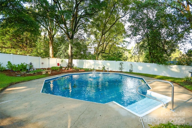 view of pool featuring a patio area, a fenced in pool, and a fenced backyard