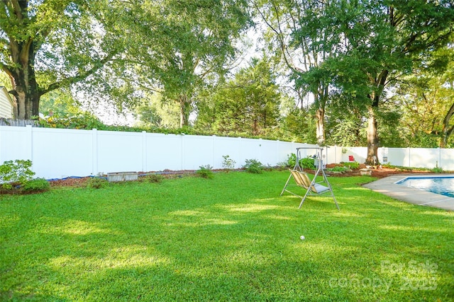 view of yard featuring a fenced backyard and a fenced in pool