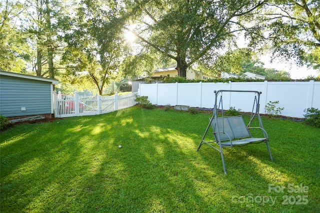 view of yard with a fenced backyard