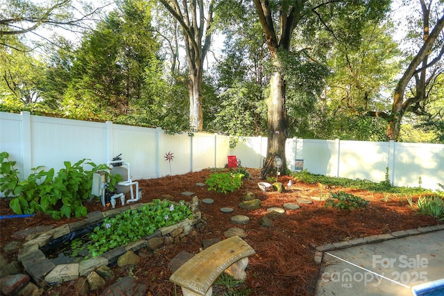 view of yard featuring a fenced backyard