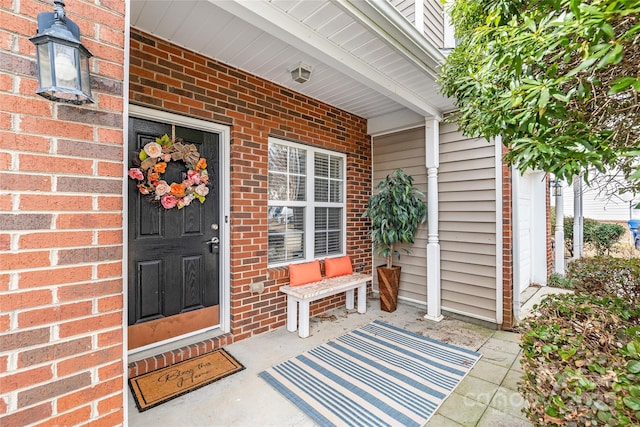 property entrance with brick siding