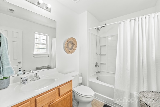 full bathroom with visible vents, vanity, toilet, and shower / tub combo with curtain