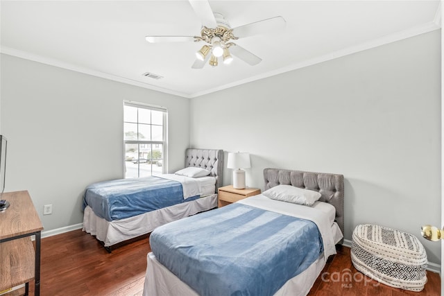 bedroom featuring crown molding, wood finished floors, visible vents, and baseboards