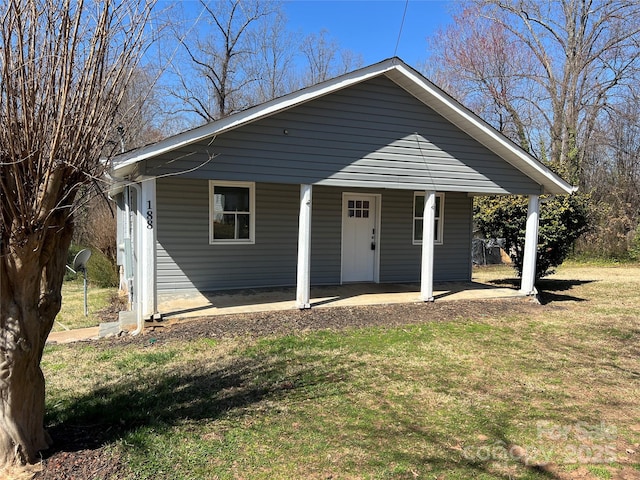 bungalow with a porch and a front yard