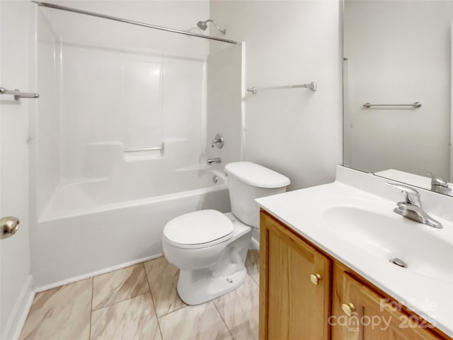 bathroom featuring washtub / shower combination, toilet, and vanity