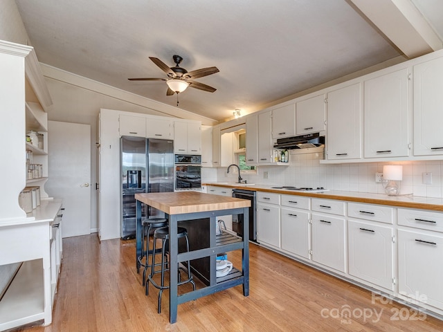 109 Joe Teague Rd, Hickory, NC 28601 - kitchen with black appliances, vaulted ceiling, ceiling fan, decorative backsplash, and white cabinetry