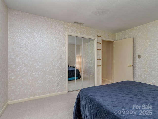 109 Joe Teague Rd, Hickory, NC 28601 - bedroom with carpet flooring, wallpapered walls, a closet, and baseboards