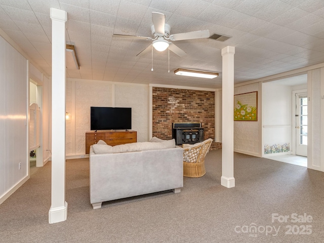 109 Joe Teague Rd, Hickory, NC 28601 - carpeted living area featuring a wood stove, ceiling fan, and baseboards