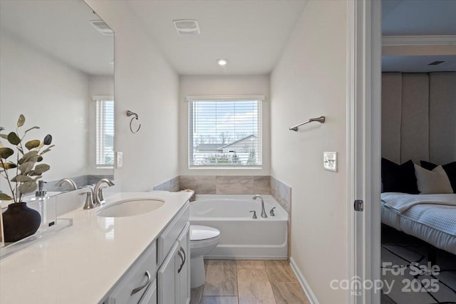 full bath featuring vanity, plenty of natural light, a bath, and visible vents