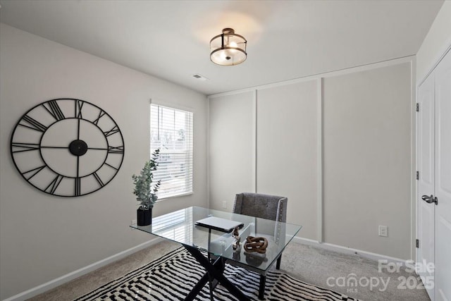 carpeted home office featuring baseboards and visible vents