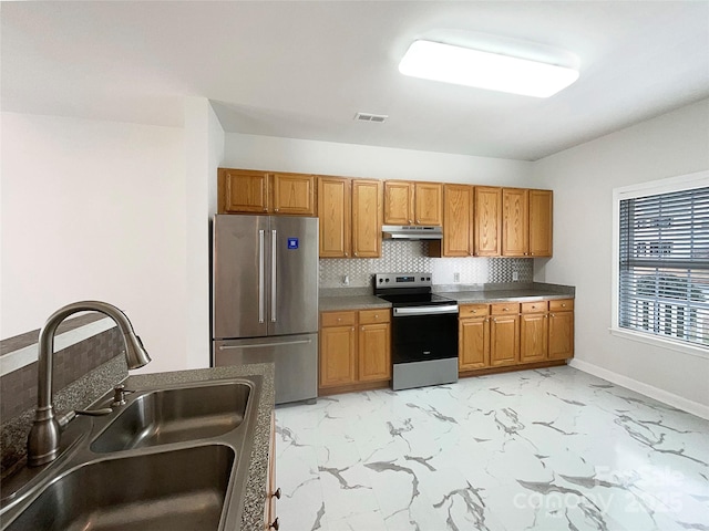 kitchen featuring visible vents, marble finish floor, a sink, under cabinet range hood, and appliances with stainless steel finishes