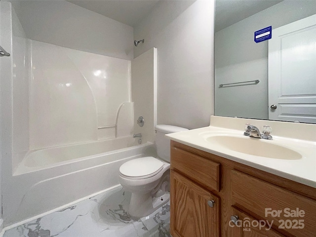 bathroom featuring vanity, toilet, marble finish floor, and shower / bath combination