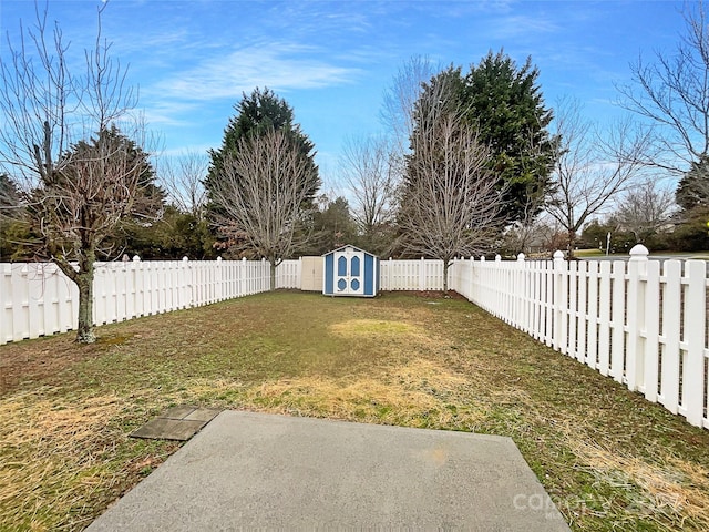 view of yard featuring a fenced backyard, a shed, and an outdoor structure