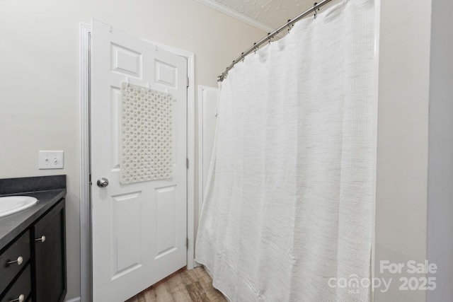 full bath featuring vanity and wood finished floors