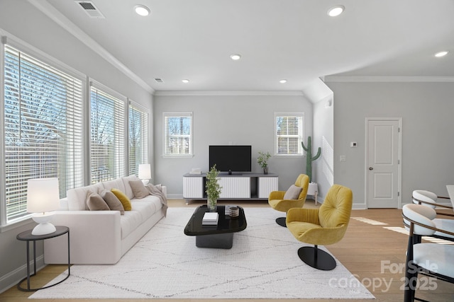 living room with recessed lighting, visible vents, wood finished floors, and ornamental molding