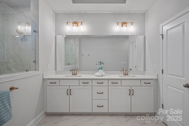 bathroom with a sink, marble finish floor, and a tile shower