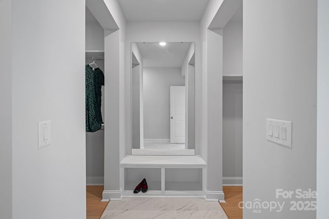 interior space featuring baseboards