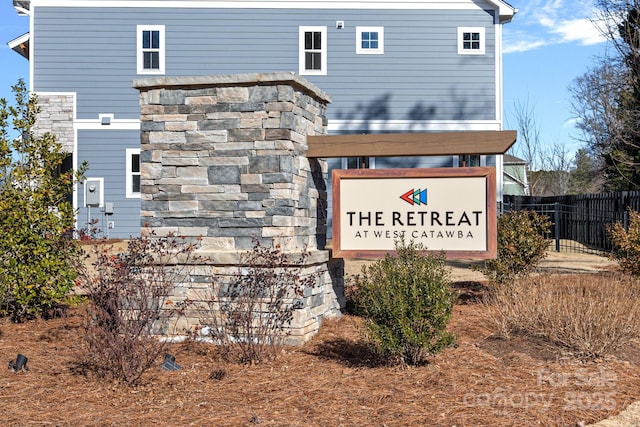 community sign with fence