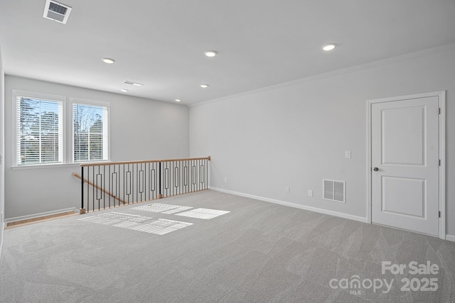 unfurnished room featuring recessed lighting, visible vents, carpet flooring, and baseboards