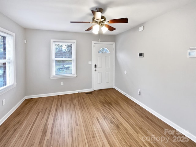 entrance foyer featuring light wood-style flooring, baseboards, and ceiling fan