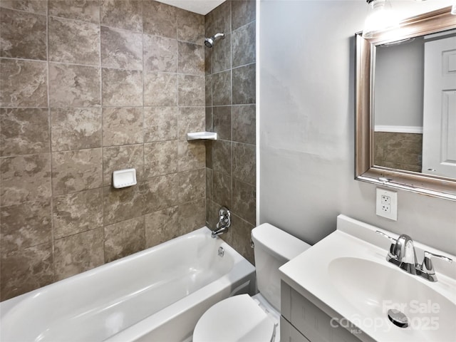 bathroom with vanity, toilet, and shower / bath combination