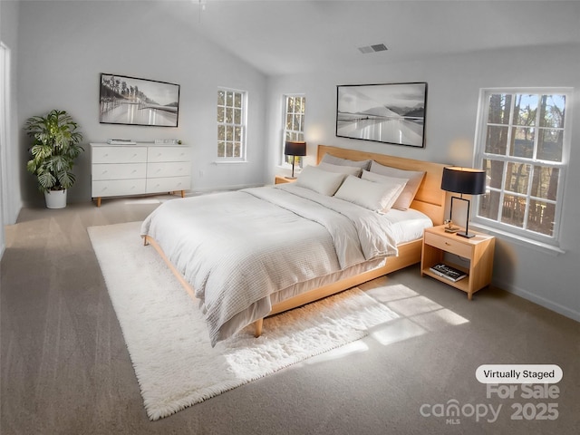 bedroom with visible vents and lofted ceiling