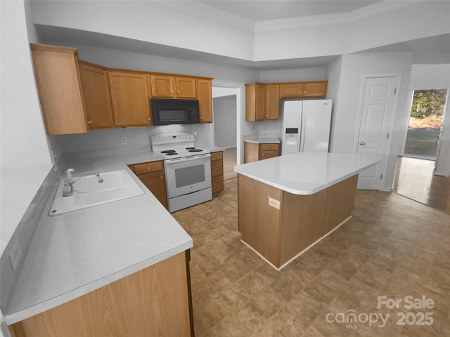 kitchen with white appliances, ornamental molding, a sink, light countertops, and a center island