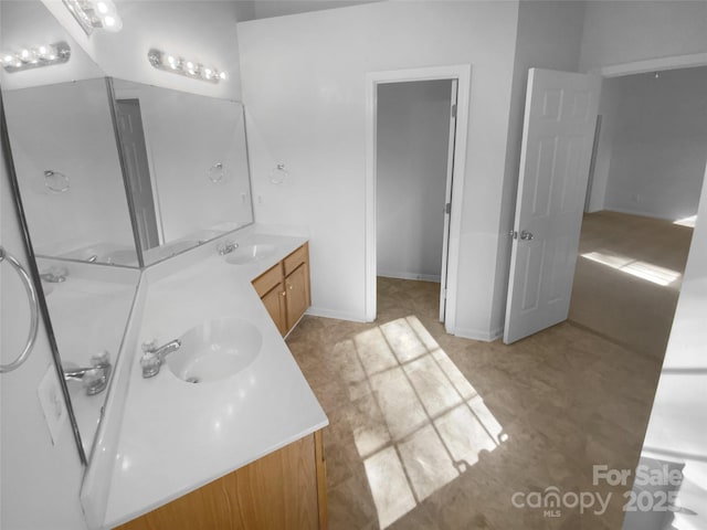 full bath featuring double vanity and a sink