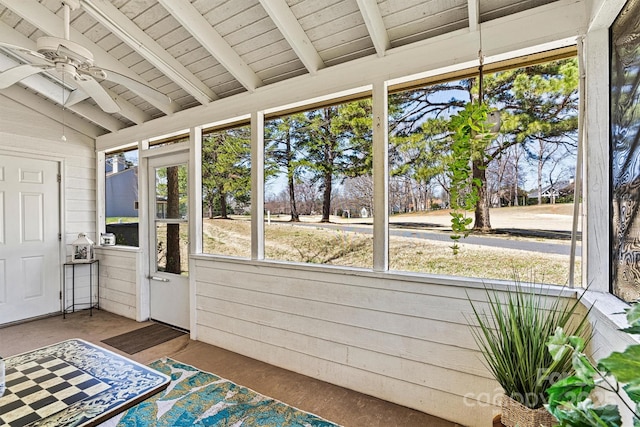 unfurnished sunroom with wooden ceiling, vaulted ceiling with beams, and ceiling fan