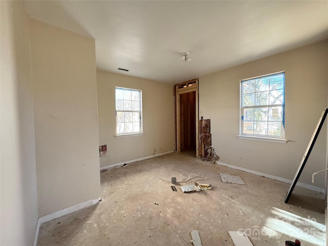 unfurnished bedroom featuring visible vents