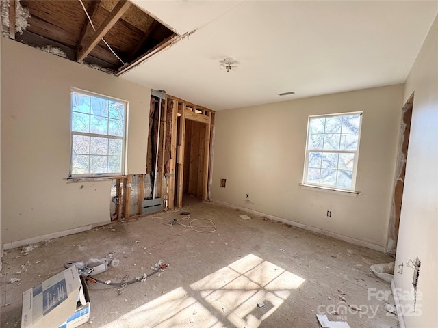 unfurnished bedroom featuring visible vents