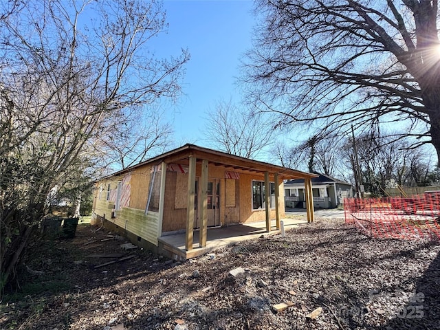 view of side of property with crawl space