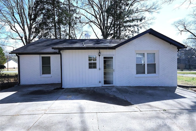 view of front of house featuring brick siding