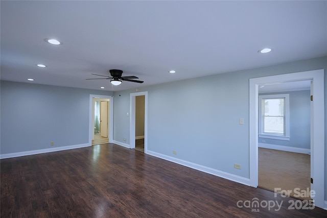 empty room featuring recessed lighting and baseboards