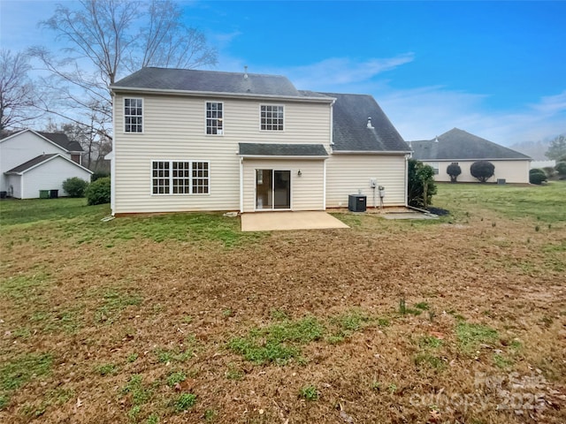 back of property with a patio area, a lawn, and cooling unit