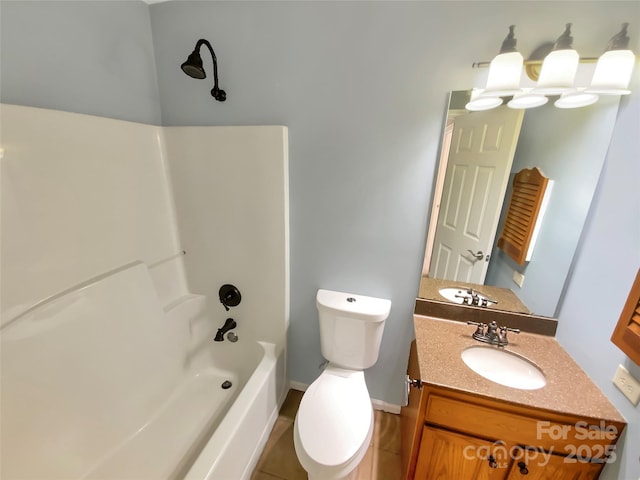 full bathroom with toilet, vanity, shower / bathtub combination, and baseboards