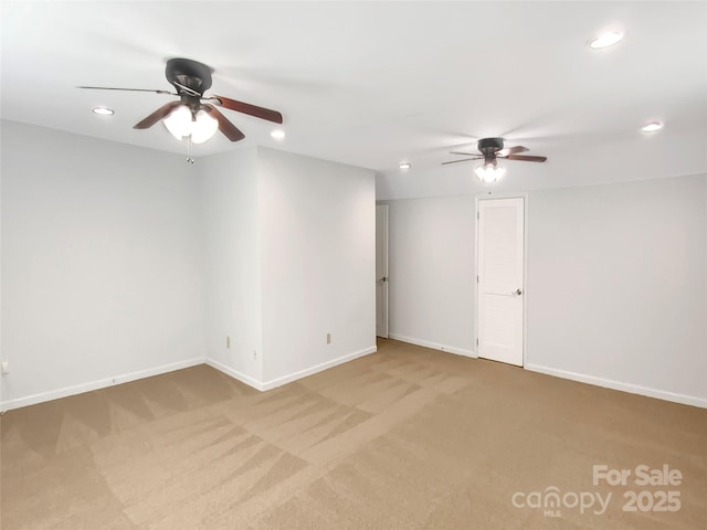 carpeted empty room featuring a ceiling fan, recessed lighting, and baseboards