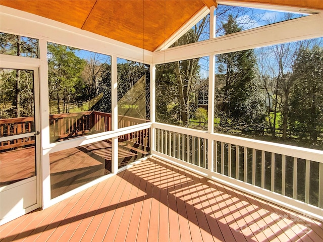 unfurnished sunroom with vaulted ceiling