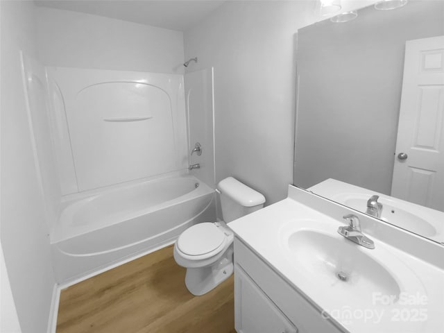 full bath with vanity, toilet, wood finished floors, and tub / shower combination