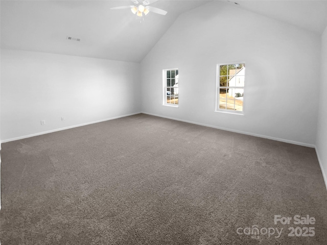 bonus room with baseboards, carpet floors, high vaulted ceiling, and ceiling fan