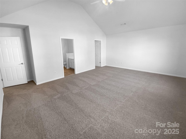 unfurnished bedroom with ceiling fan, carpet, baseboards, and high vaulted ceiling