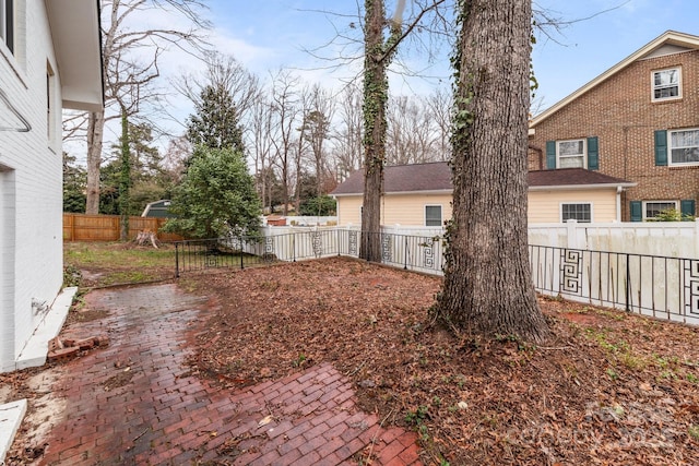 view of yard with a patio and a fenced backyard