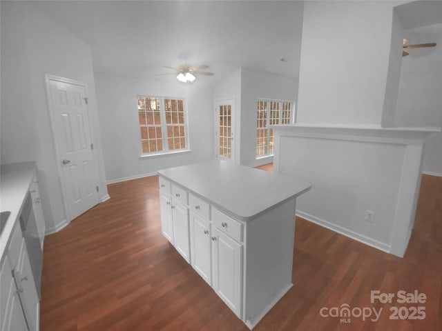 kitchen with a kitchen island, ceiling fan, and dark wood-style flooring