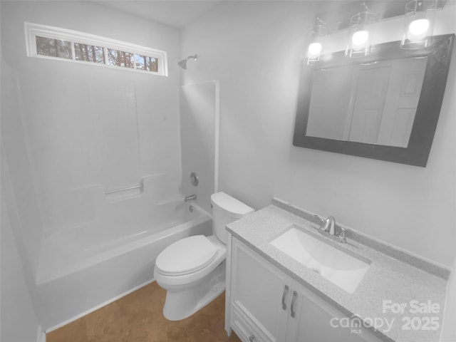 bathroom with vanity, toilet, and shower / tub combination