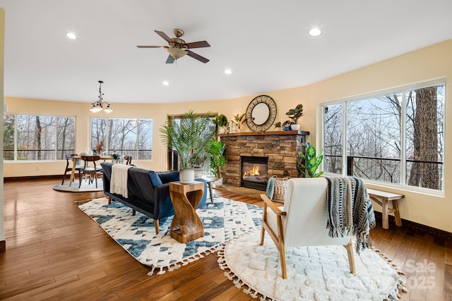 830 Fortescue Rd, Zirconia, NC 28790 - living room featuring ceiling fan with notable chandelier, plenty of natural light, and baseboards