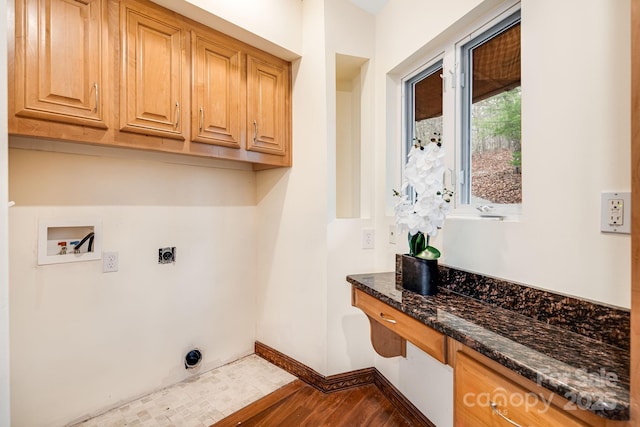 830 Fortescue Rd, Zirconia, NC 28790 - clothes washing area with wood finished floors, hookup for a washing machine, hookup for an electric dryer, cabinet space, and baseboards