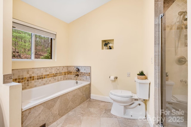 830 Fortescue Rd, Zirconia, NC 28790 - full bathroom with baseboards, a garden tub, toilet, and a stall shower