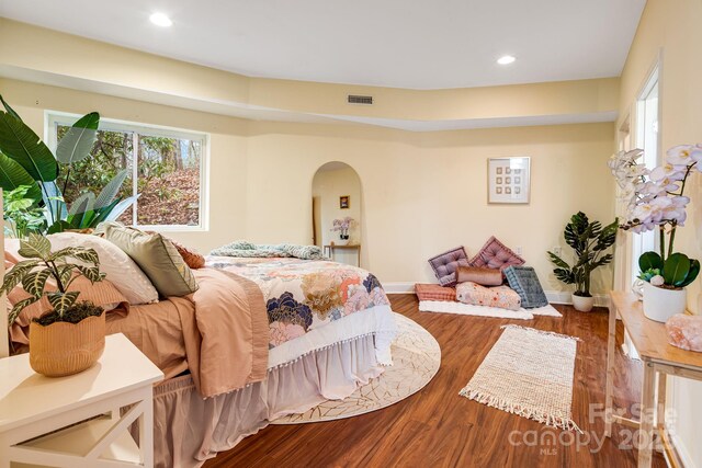830 Fortescue Rd, Zirconia, NC 28790 - bedroom with recessed lighting, wood finished floors, visible vents, arched walkways, and baseboards