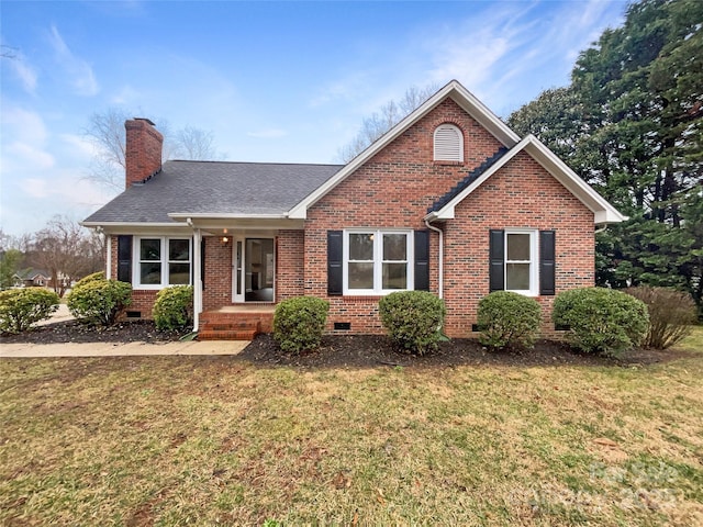 view of front facade featuring crawl space, brick siding, a chimney, and a front lawn